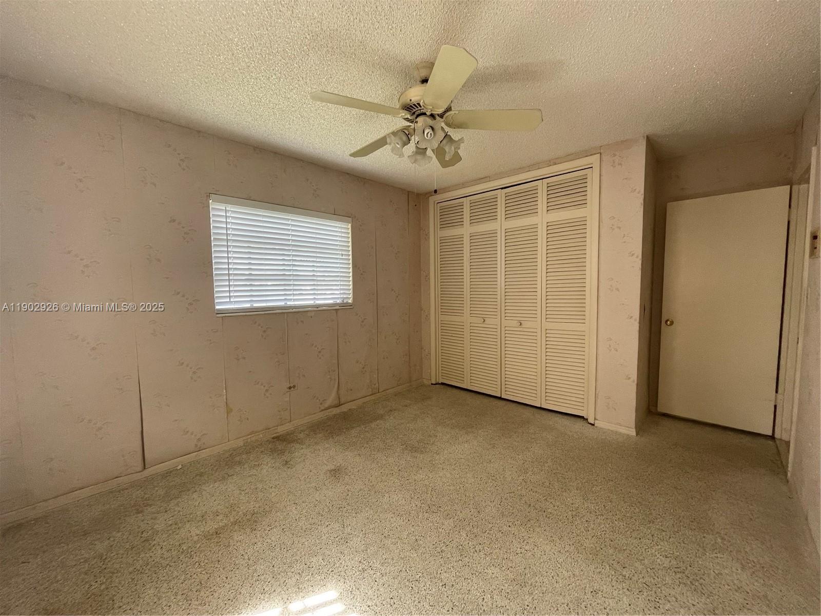 2105 Southwest 98th Avenue Miami, FL 33165 - Photo 66 of 88 an empty room with windows and fan