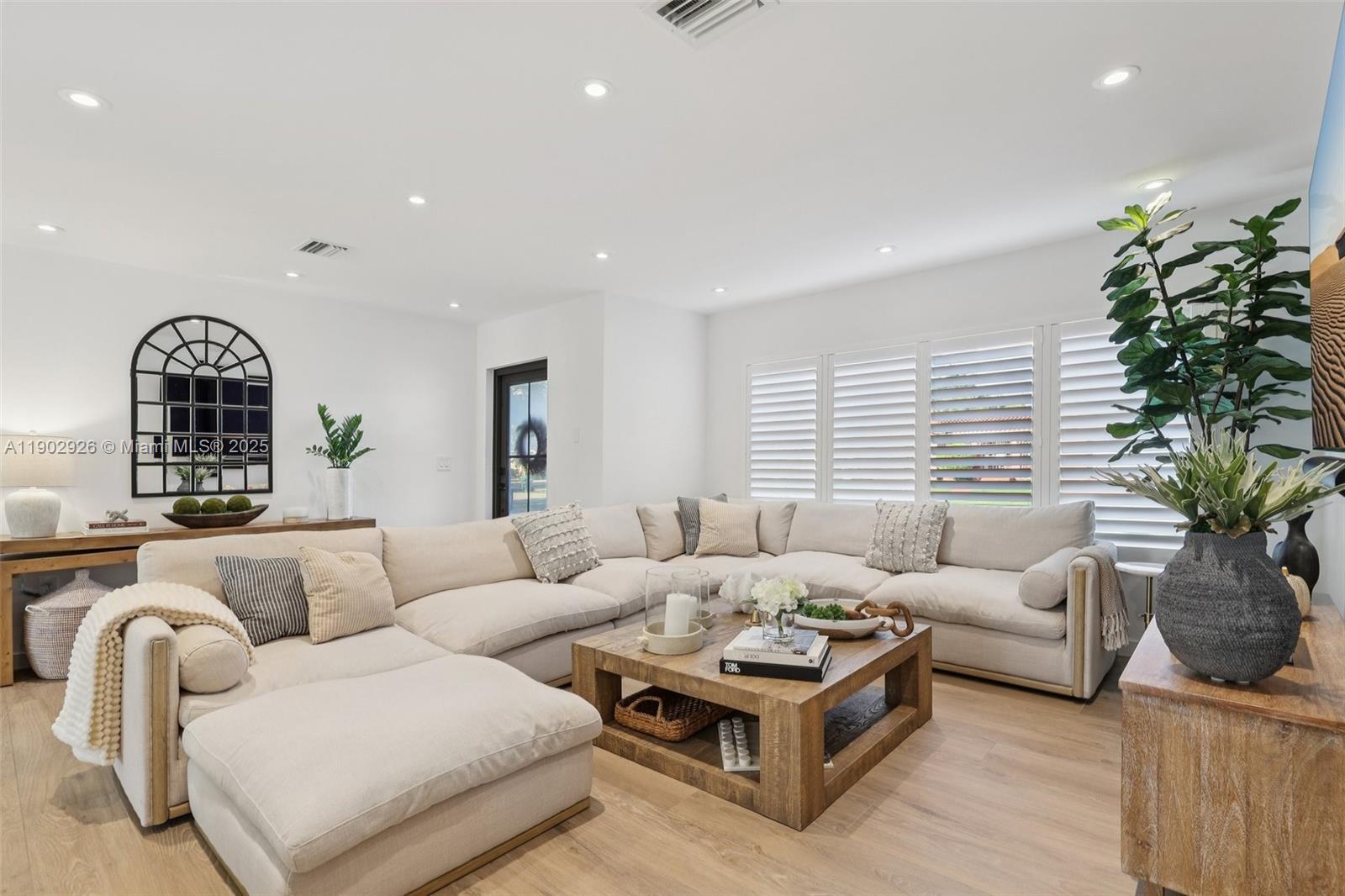 2105 Southwest 98th Avenue Miami, FL 33165 - Photo 7 of 88 a living room with furniture potted plant and a window