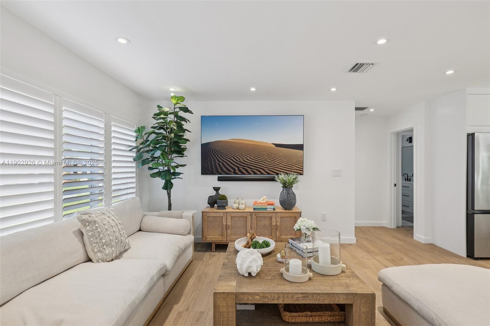 2105 Southwest 98th Avenue Miami, FL 33165 - Photo 9 of 88 a living room with furniture and a potted plant