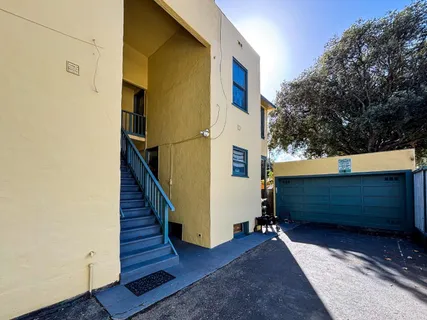 a kitchen with stainless steel appliances a sink and a refrigerator