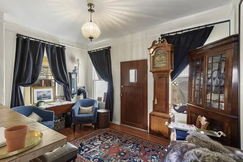 a living room with furniture and a rug