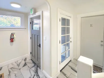 a bedroom with furniture and a window