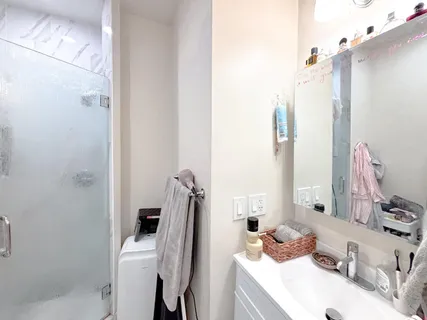 a view of hallway with wooden floor