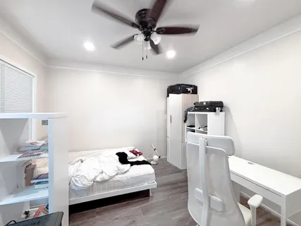 a white toilet sitting next to a bathroom sink