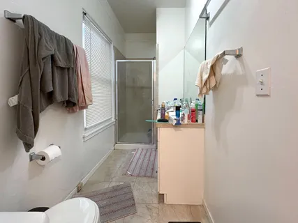 a kitchen with a sink refrigerator and window