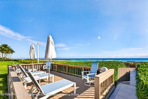 a view of a balcony with chairs