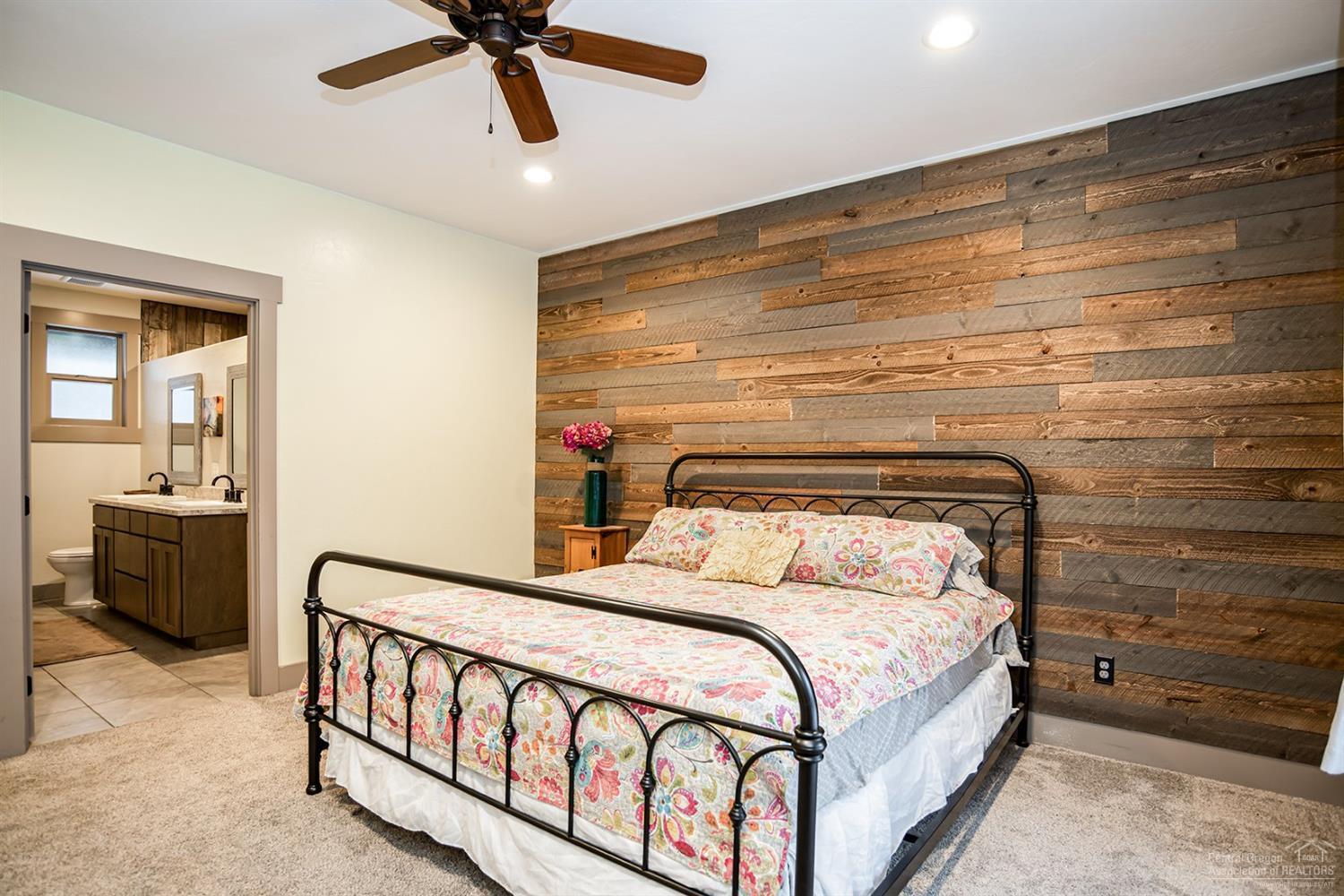 17325 Elsinore Road Bend, OR 97707 - Photo 13 of 25 Master bedroom with barnwood accent wall