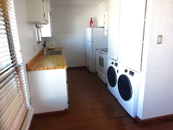 a view of a kitchen with washer and dryer