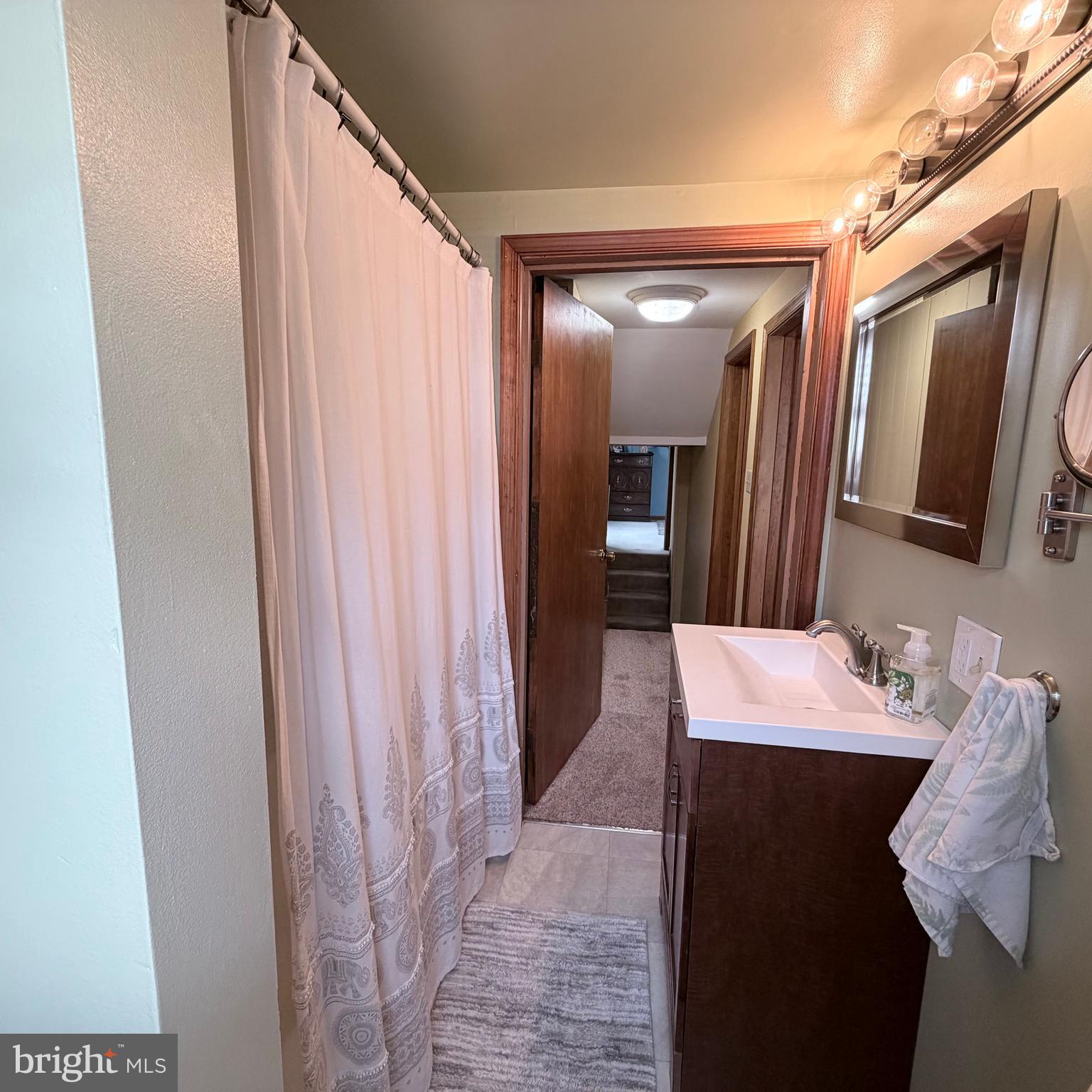 12997 Main Street Fort Loudon, PA 17224 - Photo 39 of 48 a bathroom with a sink and a mirror