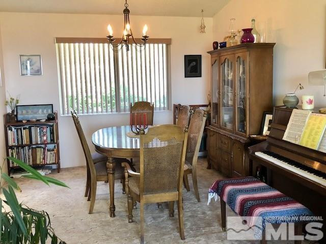 10220 Pathfinder Drive Reno, NV 89508 - Photo 14 of 36 a view of a dining room with furniture window and wooden floor