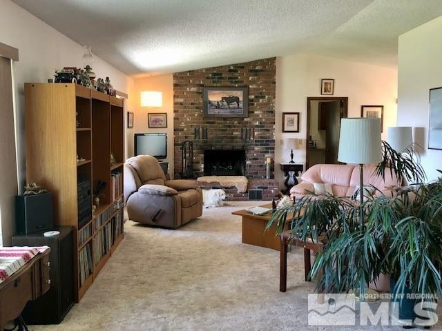 10220 Pathfinder Drive Reno, NV 89508 - Photo 9 of 36 a living room with furniture and a fireplace