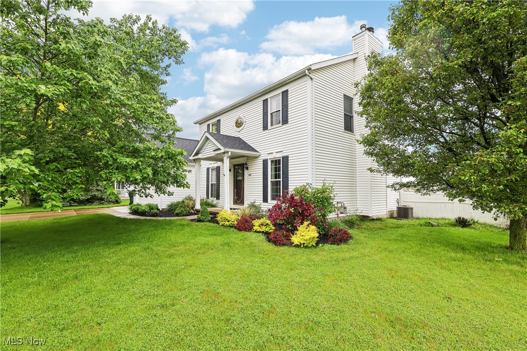 108 Joshua Drive Rittman, OH 44270 - Photo 2 of 44 View of front facade with a chimney, a front lawn, and central AC