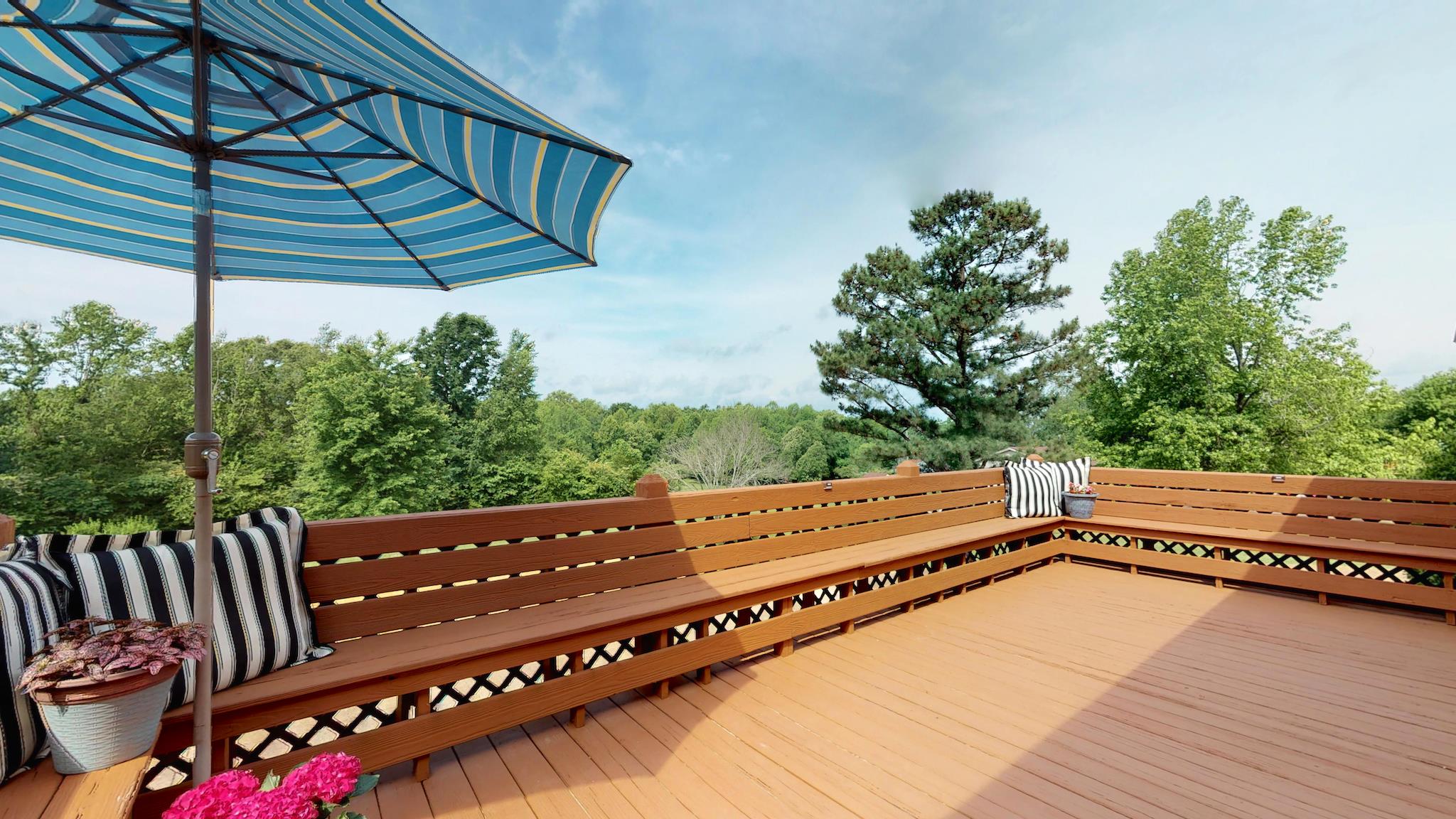 7209 Crow Cut Road Fairview, TN 37062 - Photo 12 of 30 a view of a roof deck with wooden floor and fence