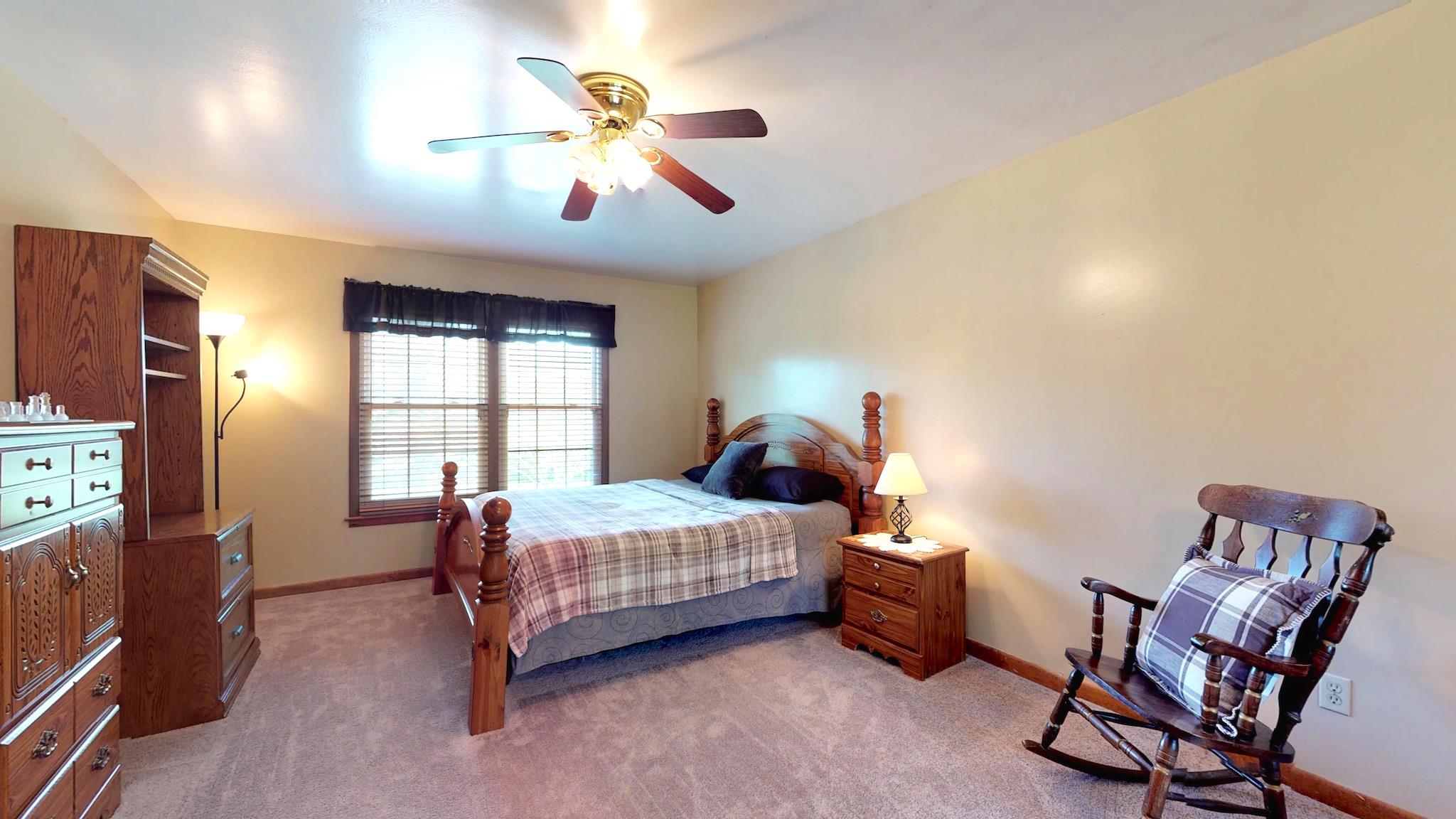 7209 Crow Cut Road Fairview, TN 37062 - Photo 13 of 30 a bedroom with a bed chair and window