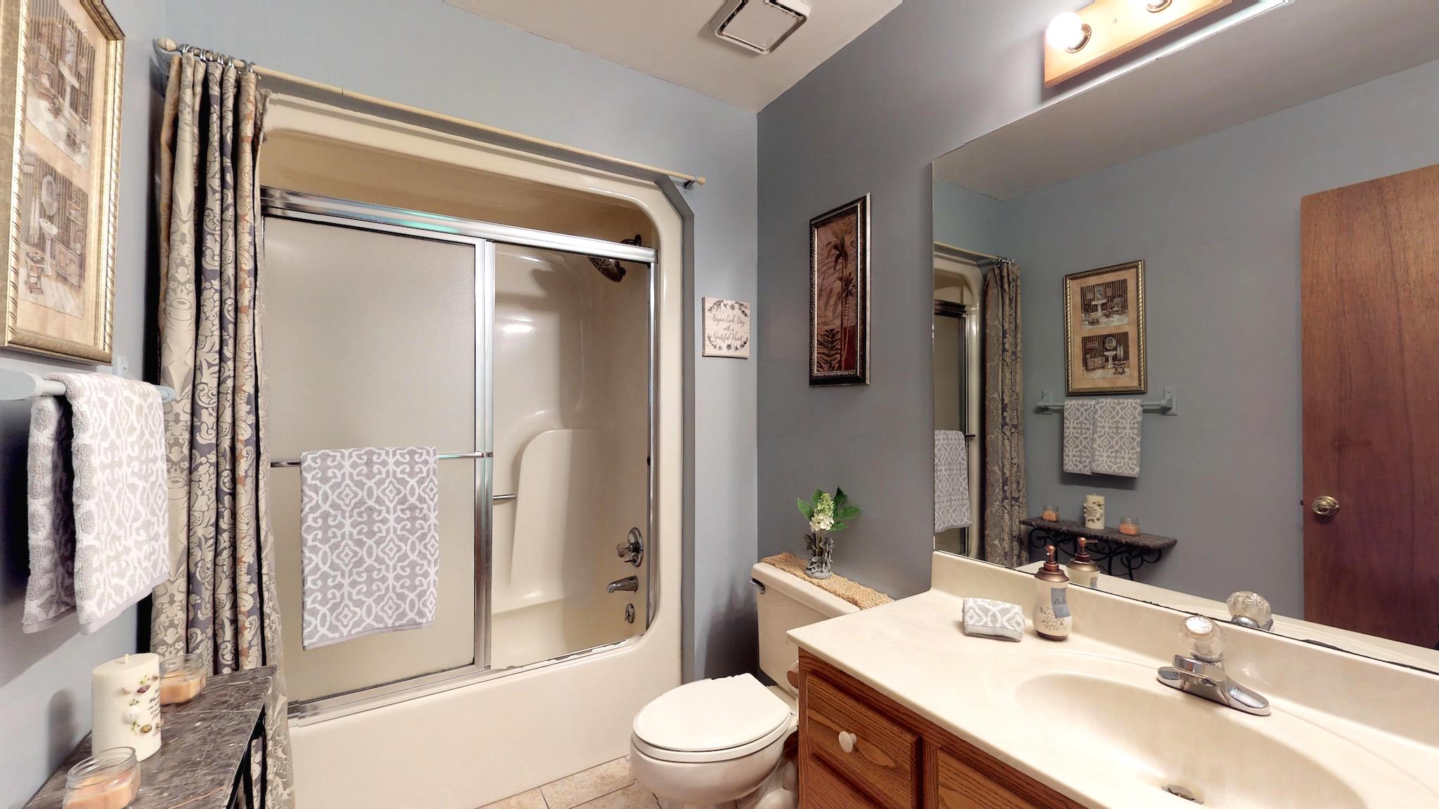 7209 Crow Cut Road Fairview, TN 37062 - Photo 15 of 30 a bathroom with a sink toilet and shower