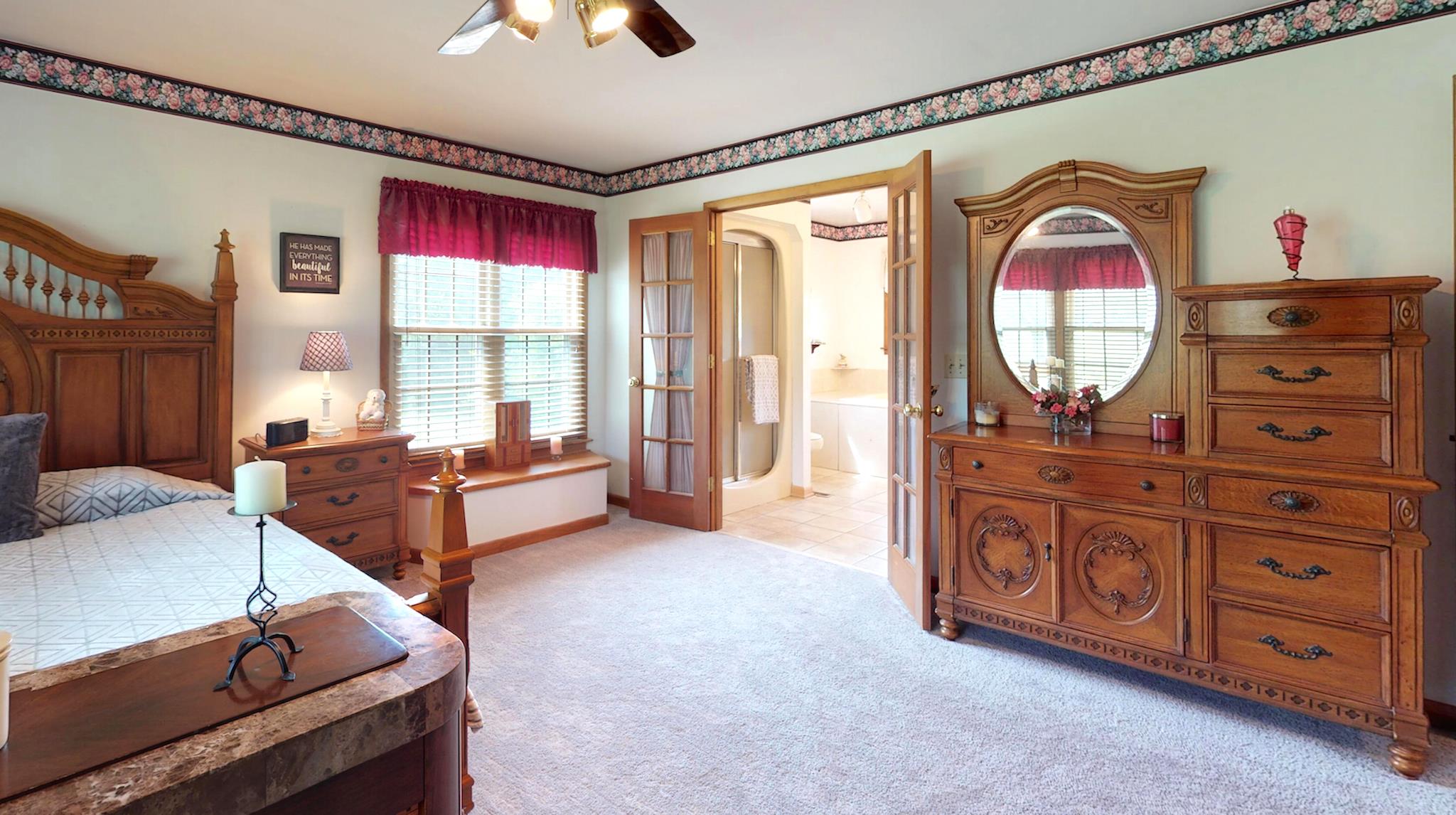 7209 Crow Cut Road Fairview, TN 37062 - Photo 19 of 30 a living room with furniture a chandelier and a dresser