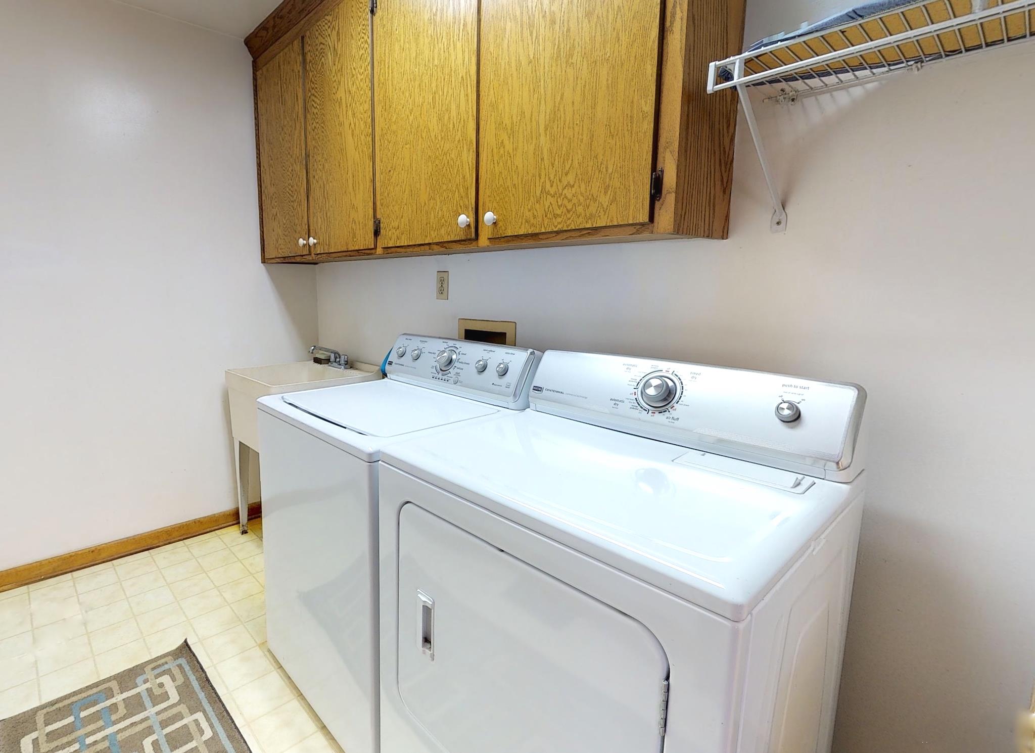 7209 Crow Cut Road Fairview, TN 37062 - Photo 22 of 30 a utility room with dryer and washer