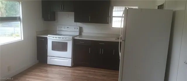 a kitchen with a stove and a refrigerator