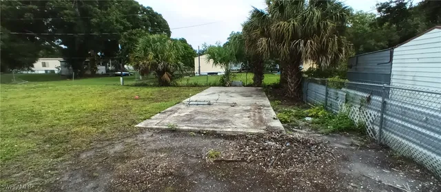a view of backyard with green space