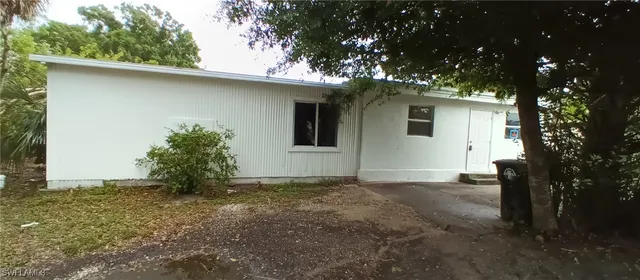 a view of a house with a tree