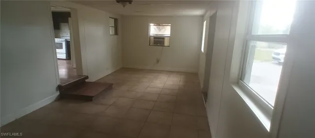 an empty room with windows