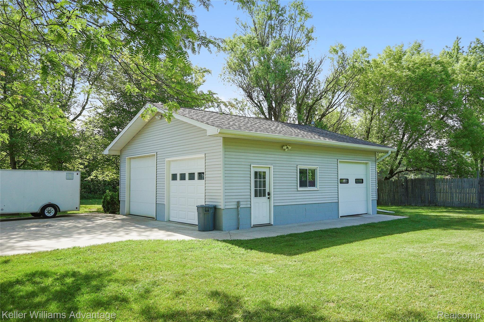 944 Chase Lake Road Howell, MI 48855 - Photo 2 of 36 30x30 pole barn is heated and insulated, with 10-foot door and epoxy floors. It's immaculate!