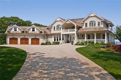 a front view of a house with swimming pool having outdoor seating