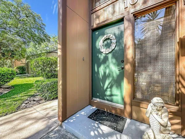 a view of a door and a window of the house