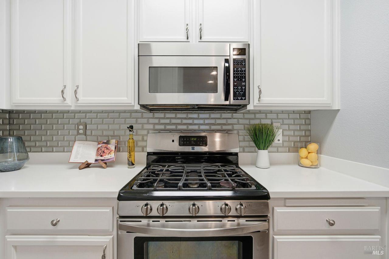 384 Mark West Commons Circle Santa Rosa, CA 95403 - Photo 14 of 44 a stove top oven sitting inside of a kitchen