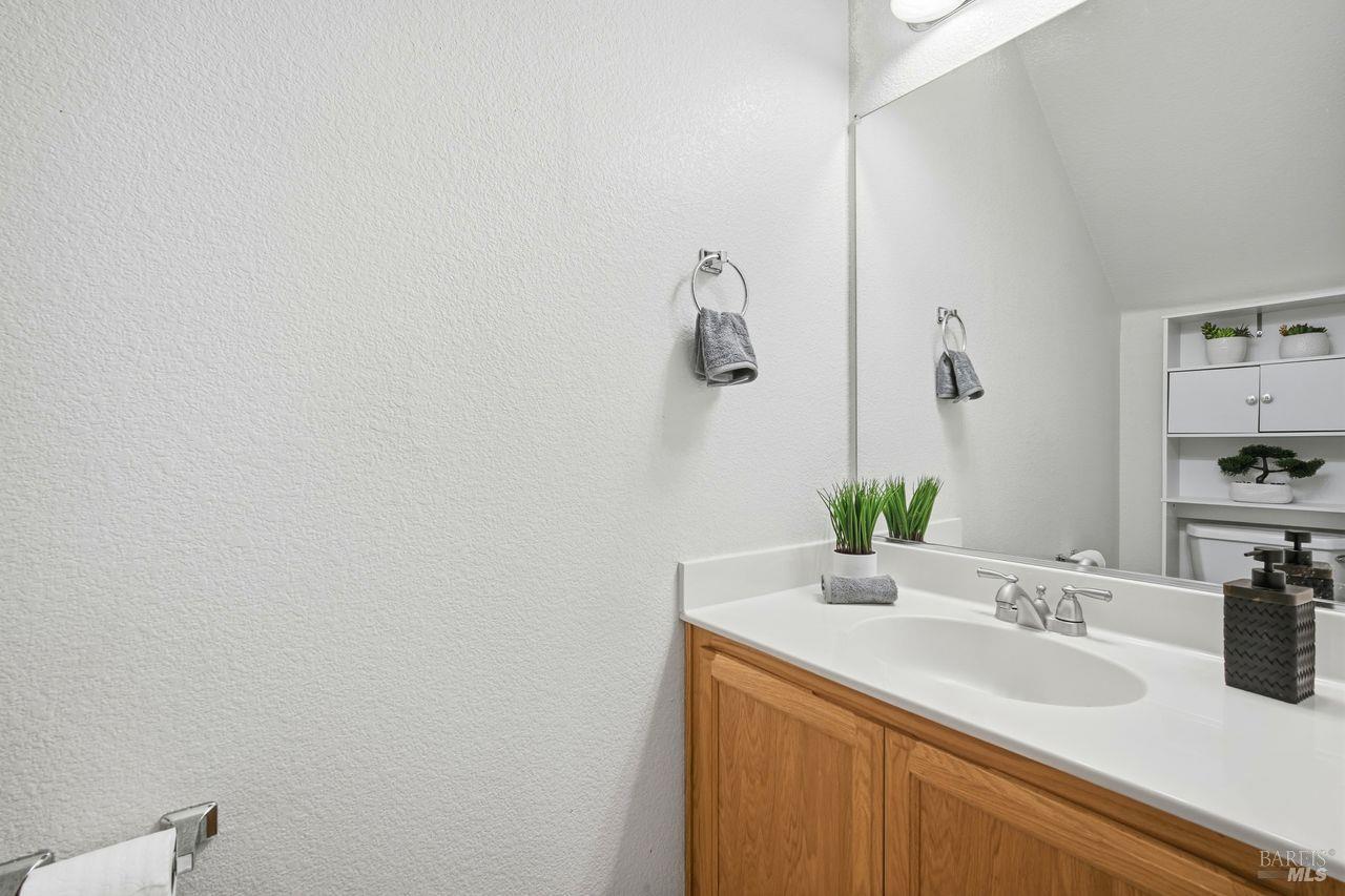 384 Mark West Commons Circle Santa Rosa, CA 95403 - Photo 16 of 44 a bathroom with a sink and a mirror
