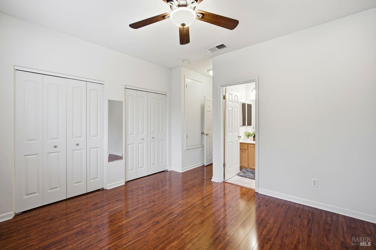 384 Mark West Commons Circle Santa Rosa, CA 95403 - Photo 25 of 44 a view of an empty room with wooden floor