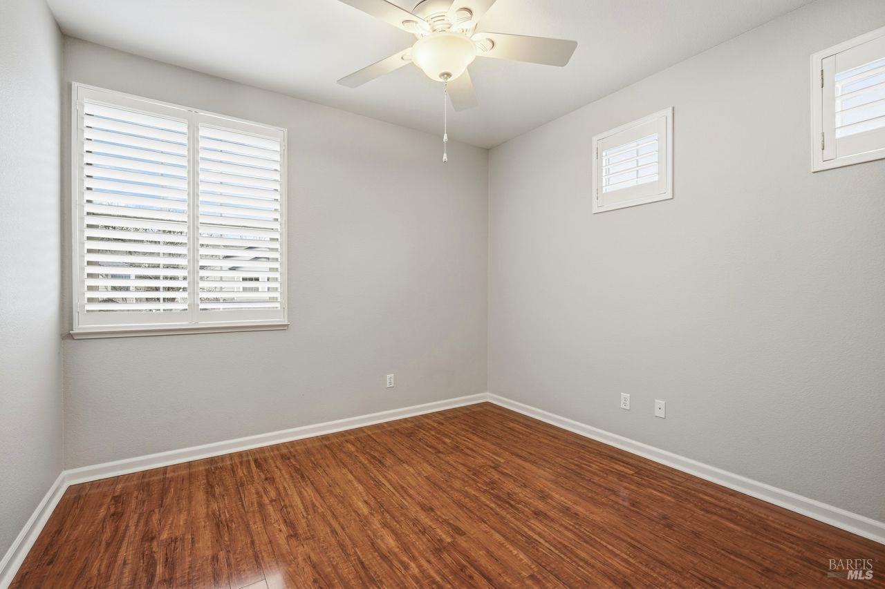 384 Mark West Commons Circle Santa Rosa, CA 95403 - Photo 30 of 44 an empty room with a window and wooden floor