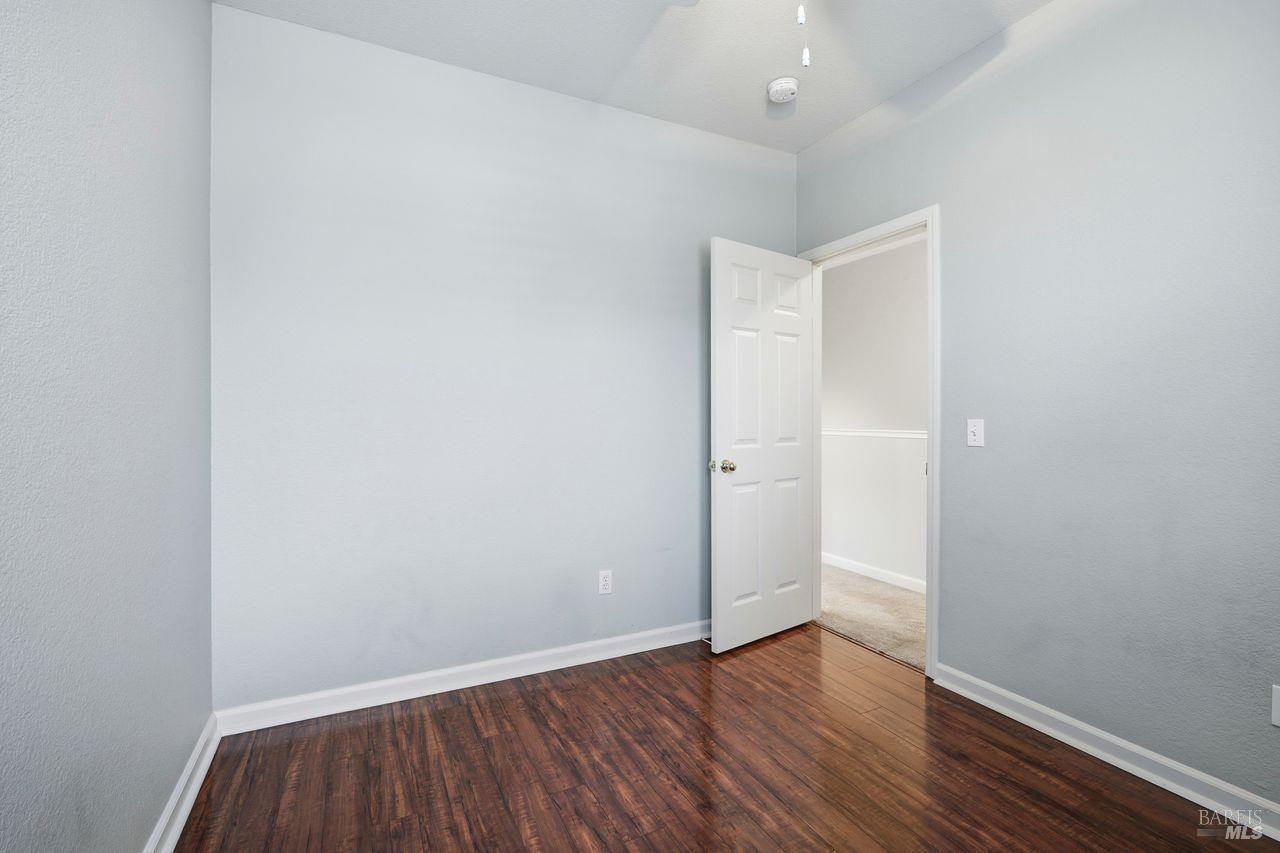384 Mark West Commons Circle Santa Rosa, CA 95403 - Photo 38 of 44 a view of an empty room with wooden floor