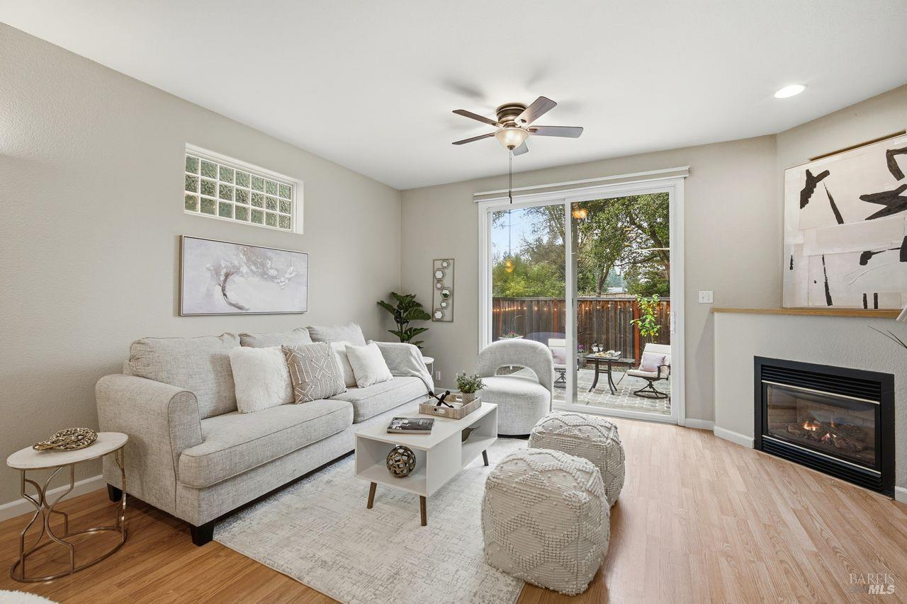 384 Mark West Commons Circle Santa Rosa, CA 95403 - Photo 5 of 44 a living room with furniture and a fireplace