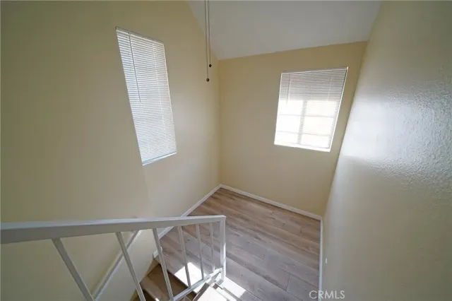 a view of room with window and hardwood floor