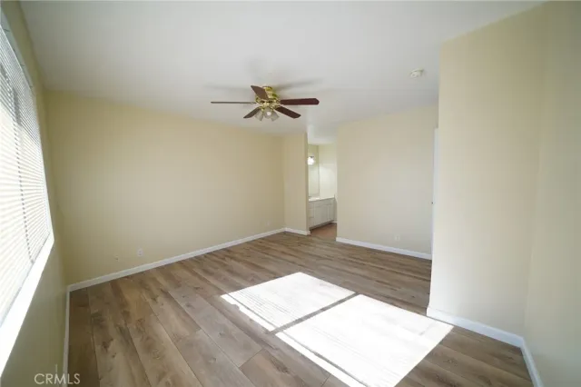 a view of an empty room and a window
