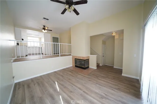 a view of a livingroom with a furniture and wooden floor