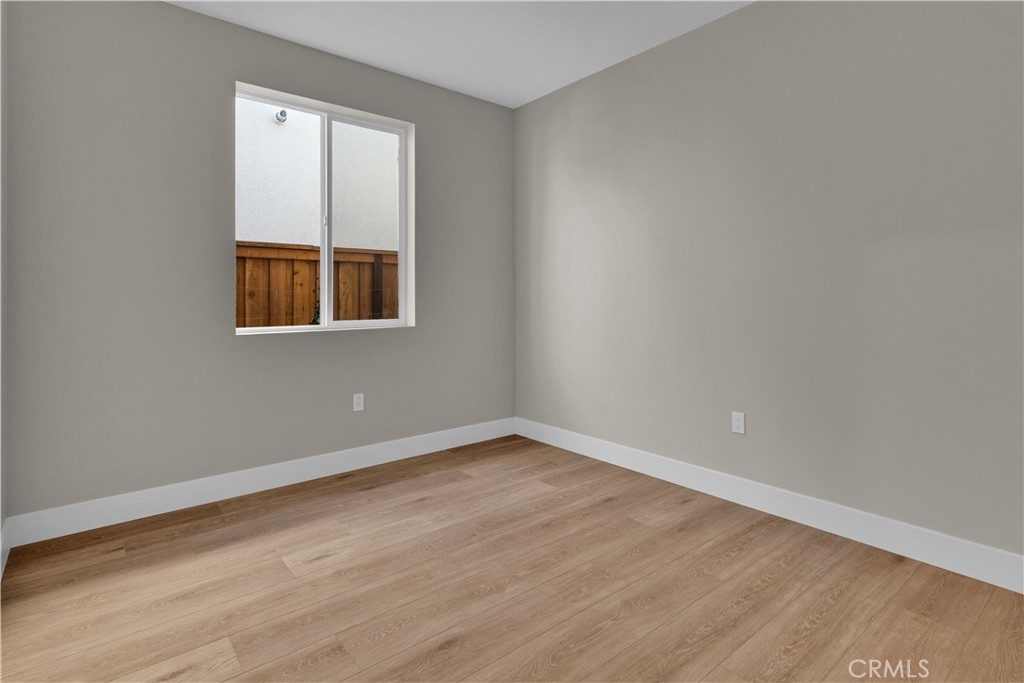 3730 Rosado Road Paso Robles, CA 93446 - Photo 12 of 17 an empty room with wooden floor and windows