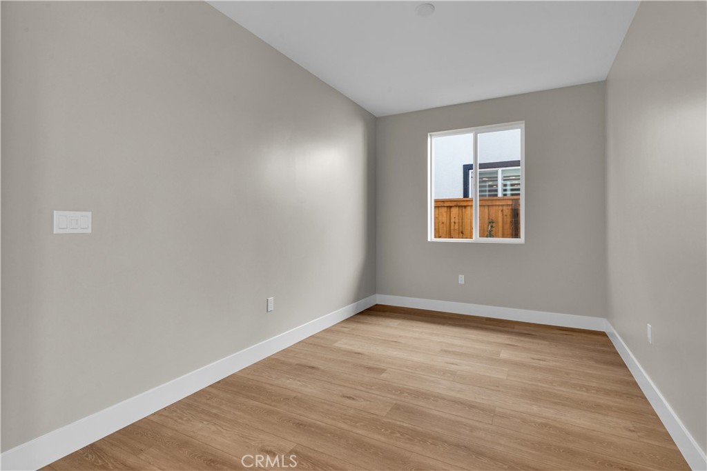 3730 Rosado Road Paso Robles, CA 93446 - Photo 14 of 17 an empty room with wooden floor and windows