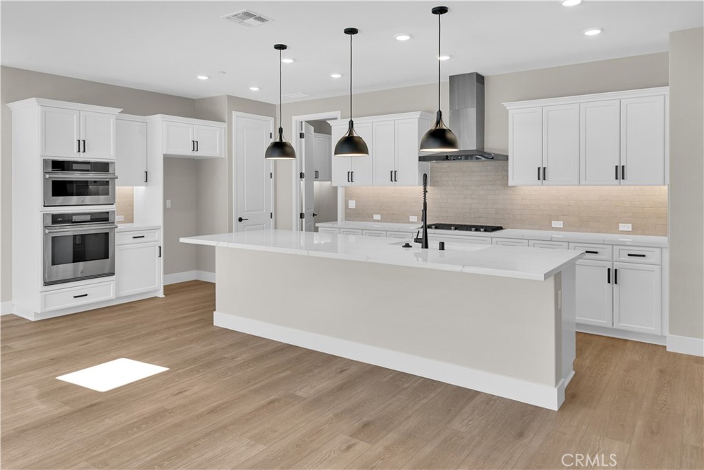 3730 Rosado Road Paso Robles, CA 93446 - Photo 2 of 17 a large kitchen with stainless steel appliances kitchen island a large counter top a sink appliances and cabinets