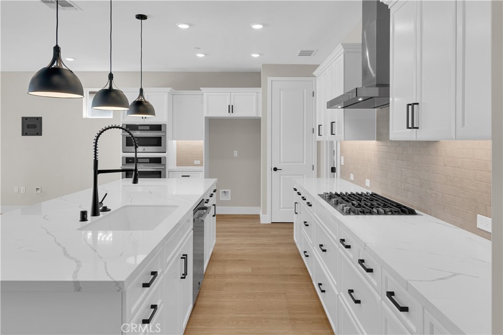 3730 Rosado Road Paso Robles, CA 93446 - Photo 3 of 17 a kitchen with stainless steel appliances a sink stove and cabinets