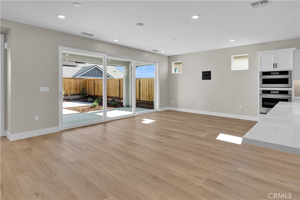 3730 Rosado Road Paso Robles, CA 93446 - Photo 5 of 17 an empty room with wooden floor and windows