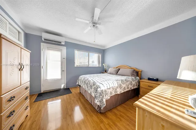 a bedroom with two beds and a chandelier