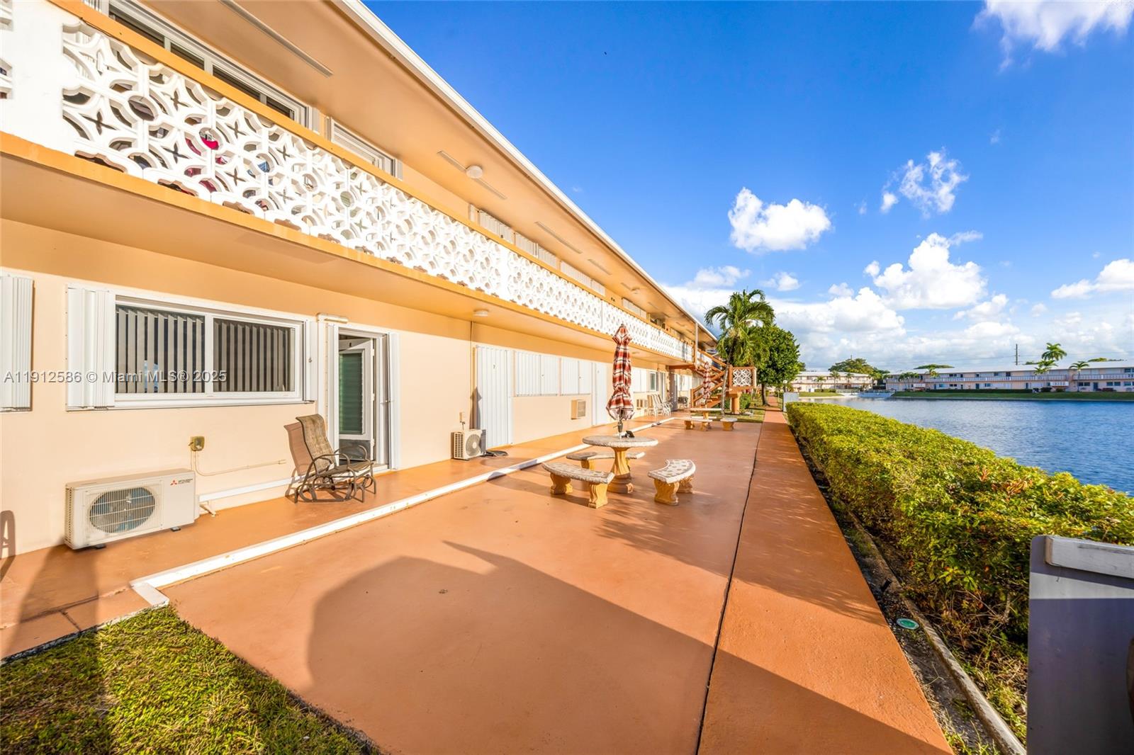 900 Southwest 10th Terrace, Unit 8S Hallandale Beach, FL 33009 - Photo 20 of 33 a swimming pool with outdoor seating and yard