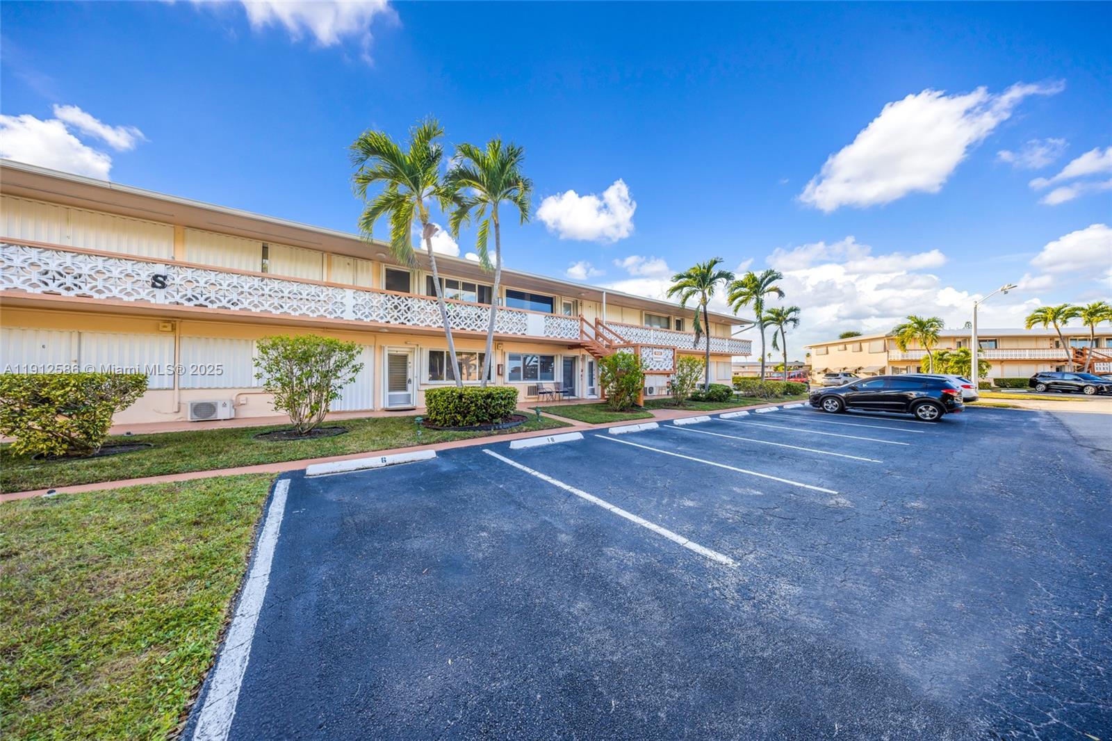 900 Southwest 10th Terrace, Unit 8S Hallandale Beach, FL 33009 - Photo 23 of 33 a view of a building with a yard