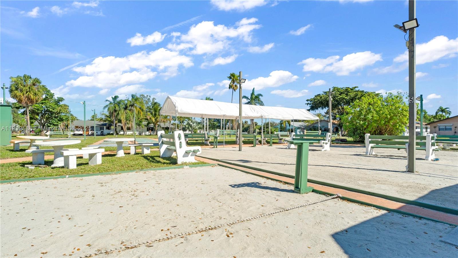 900 Southwest 10th Terrace, Unit 8S Hallandale Beach, FL 33009 - Photo 29 of 33 a view of a swimming pool with an outdoor seating