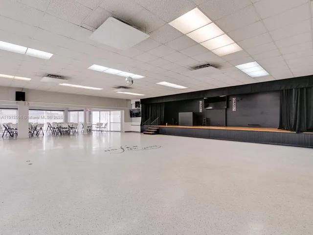 a view of a big room with kitchen view and a window