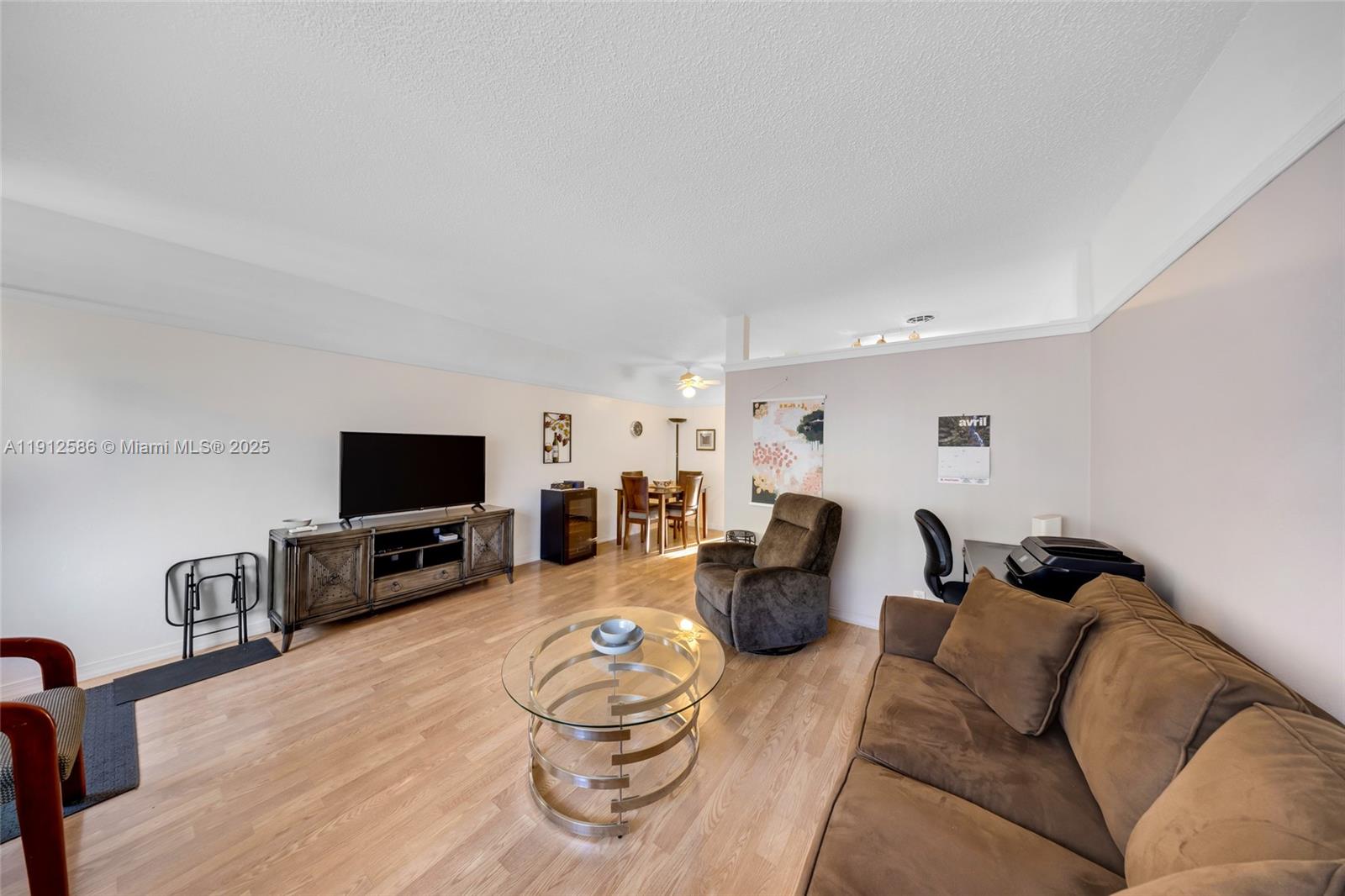 900 Southwest 10th Terrace, Unit 8S Hallandale Beach, FL 33009 - Photo 5 of 33 a living room with furniture and a flat screen tv