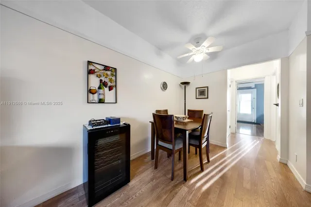 a view of a workspace with furniture and wooden floor