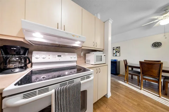 a kitchen with a stove and a refrigerator